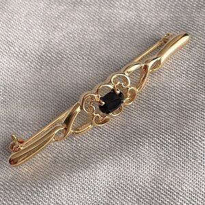 Brooch gold tone and Black stone
